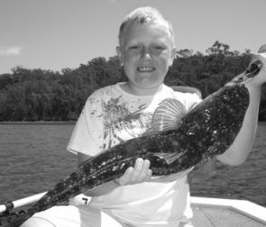 Lucas Krause, 7, of Melbourne, with a quality 60cm flattie he caught using soft plastics for the first time.